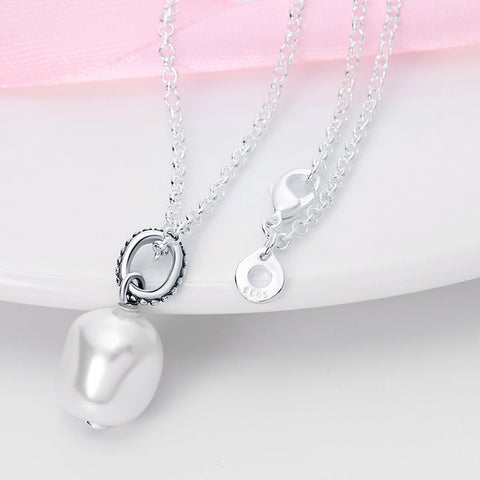 Minimalist Silver Pearl Pendant Necklace for Women - Close-up of a silver necklace with a pearl pendant, featuring a secure clasp and a stamp on a small tag.
