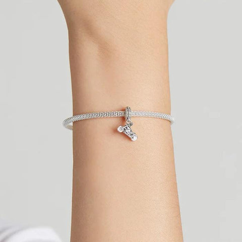Exquisite Silver Harley-Davidson Motorcycle Charm for Enthusiasts - A sterling silver bracelet with a Harley-Davidson motorcycle charm, elegantly worn on a wrist, showcasing a stylish and biker-inspired look.