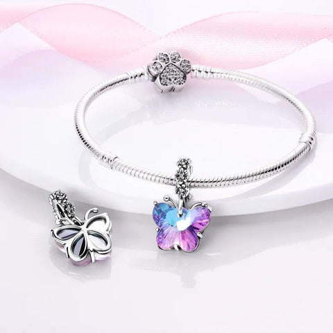 Sterling Silver Radiant Crystal Butterfly Charm for Pandora Bracelets - Sterling silver bracelet charm featuring a butterfly with radiant blue and pink crystals, perfect for adding sparkle.