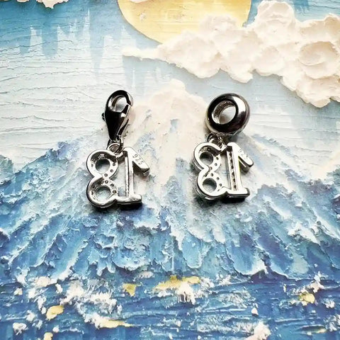 Silver number charms.