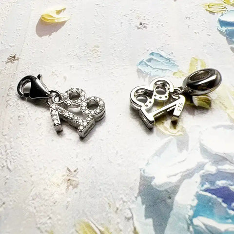 Silver ''' charm pendants.