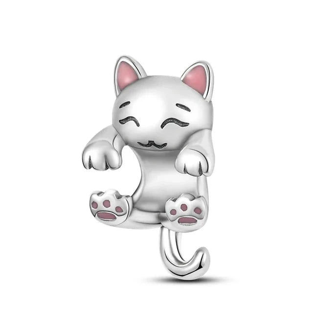 charm of a cat playfully hanging from a bracelet, featuring pink paws and a cute expression, fits with Pandora charms.