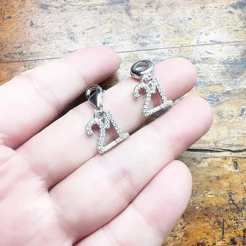 Two silver number charms.