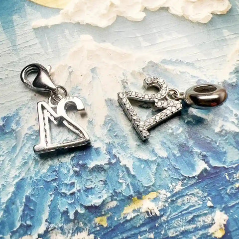 Two silver number charms.