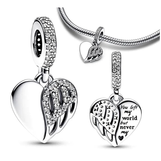 Silver heart-shaped pendant with engraved message on a white background