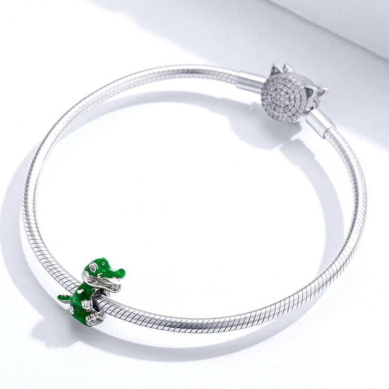 Sterling silver and green enamel dinosaur charm designed to fit Pandora bracelets, sparkling