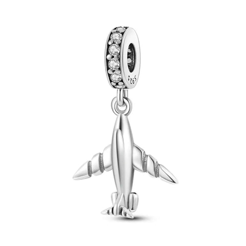 Sterling silver airplane charm with cubic zirconia accents, ideal for travel lovers or aviation enthusiasts.