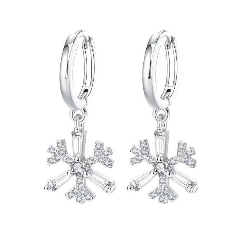 Elegant silver flower drop earrings with clear crystals on a white background.