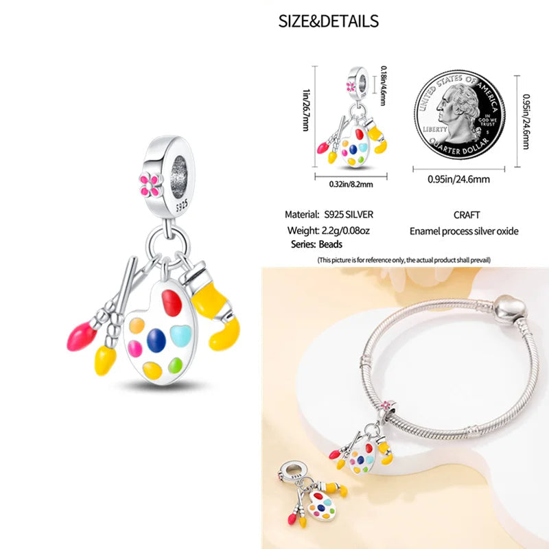 Artist's palette and brushes charm in sterling silver with colorful enamel accents.