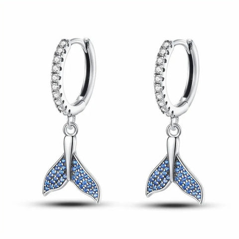 Whimsical Sterling Silver Mermaid Tail Dangle Earrings - Sterling silver mermaid tail dangle earrings with blue stones.