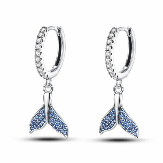 Sterling silver mermaid tail dangle earrings with blue stones.