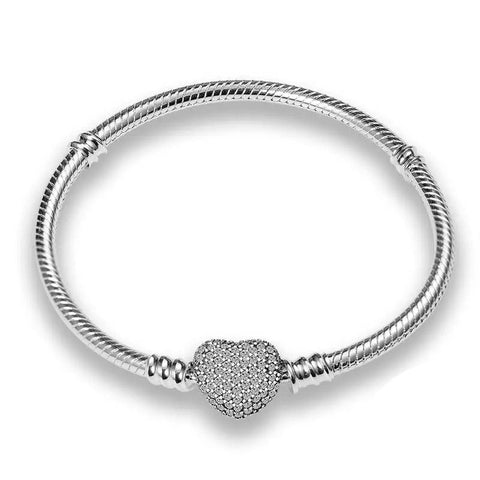 Heart-Shaped Sparkling Charm Sterling Silver Bracelet - Sterling silver bracelet with a heart-shaped charm encrusted with shimmeband stones.
