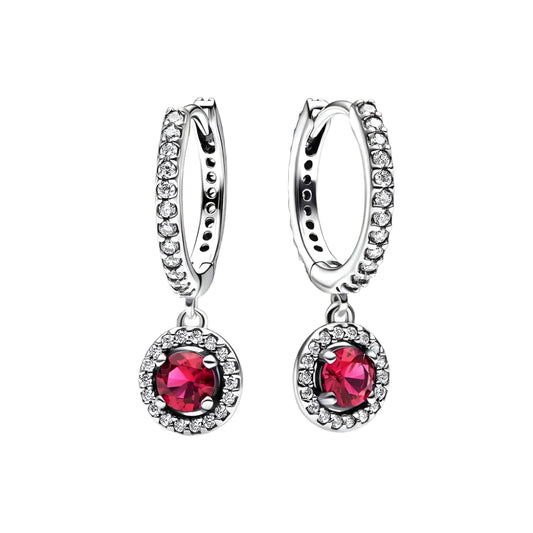 Gorgeous ruby drop earrings with a sterling silver hoop design and intricate detailing.