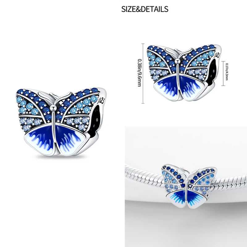 Sterling silver butterfly charm with blue crystals for bracelets.