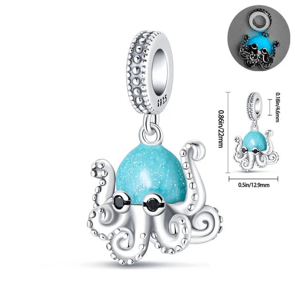 Blue Sparkle Octopus Charm - Blue sparkle octopus charm with silver tentacles and a glittery blue enamel head.