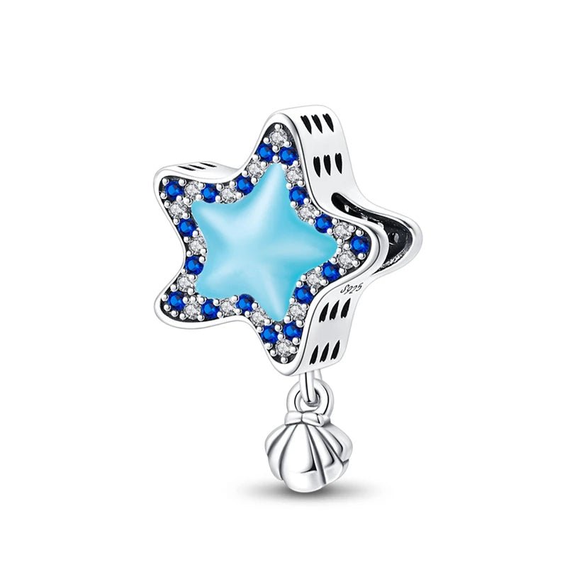 Blue star charm with sparkling crystals and a small silver shell, made from 925 sterling silver.