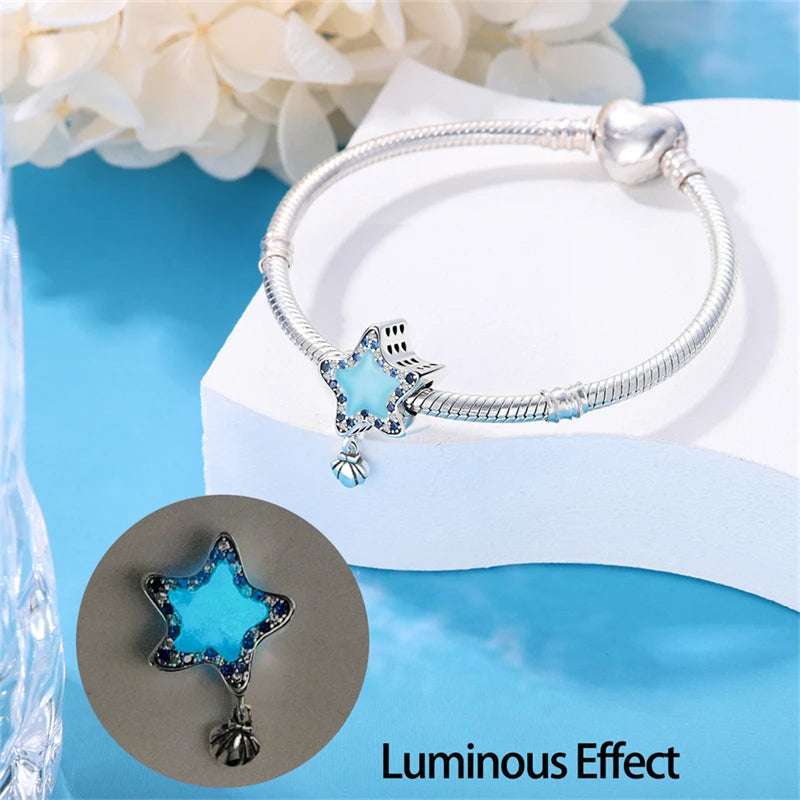 925 sterling silver star charm with blue enamel and sparkling crystals.