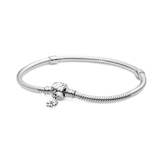 Sterling silver bracelet with a daisy dangle charm, compatible with Pandora charms.