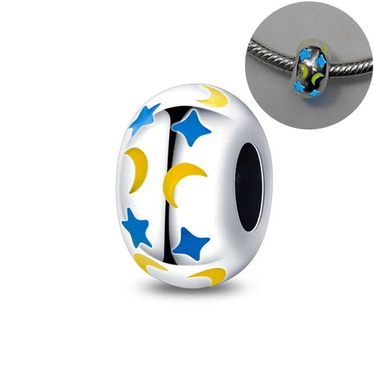 Celestial bead with blue stars and yellow moons on luminous enamel, designed for Pandora bracelets.