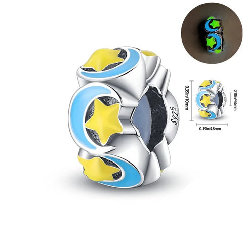 Round charm with yellow stars and blue crescent moons on a sterling silver base.