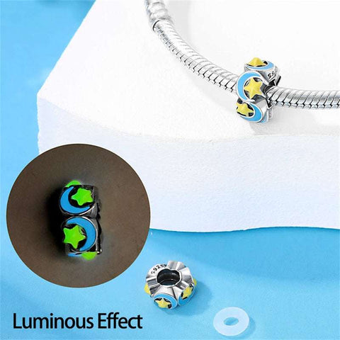 Celestial Stars and Moon Charm - Celestial charm with vibrant yellow stars and blue moons on silver.