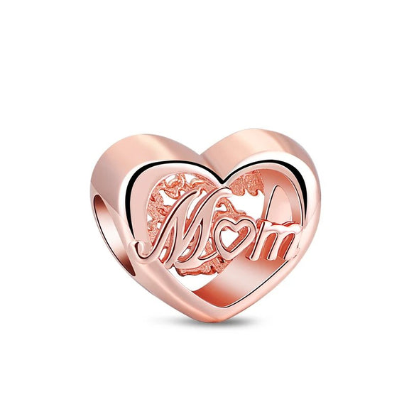 Mom Heart Charm in Rose Gold - Rose gold heart charm with the word Mom inscribed, symbolizing love and appreciation for mothers.