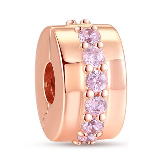 Rose gold barrel charm with pink crystals. A stylish and versatile addition to any bracelet.