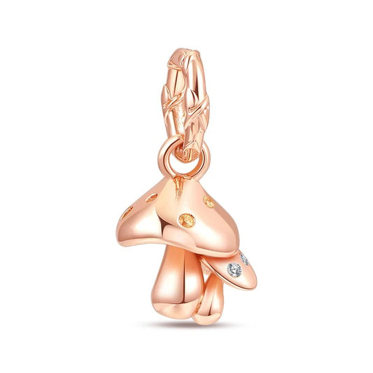 Whimsical mushroom charm in rose gold, accented with delicate crystals for a magical touch.