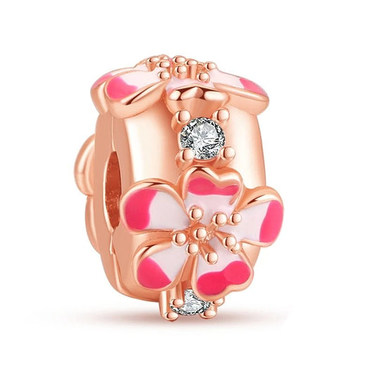 Rose gold feather dangle charm with crystal inlay. Perfect for nature-inspired charm bracelets.