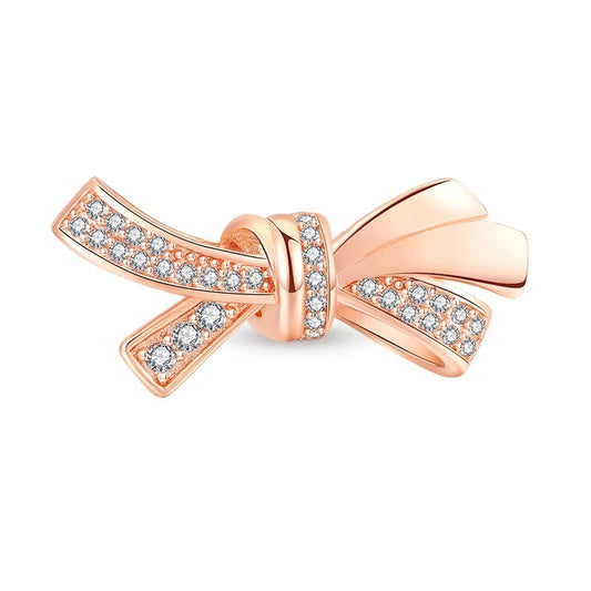 Rose gold bow tie charm with crystals, adding sparkle to Pandora charm bracelets.