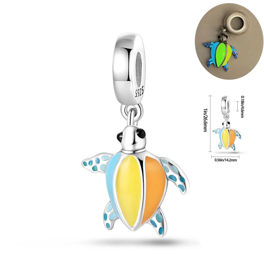 Colorful sea turtle charm with blue, yellow, and orange enamel accents on a 925 sterling silver.