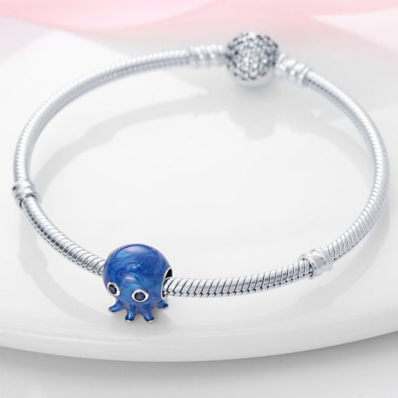 Deep Blue Octopus Charm with Crystal Eyes in Sterling Silver - Enamel-coated blue octopus charm with gemstone eyes, crafted from sterling silver, ideal for adding a nautical touch to your bracelet.