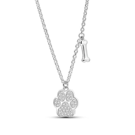 Sterling silver necklace featuband a paw print pendant and a small bone charm.
