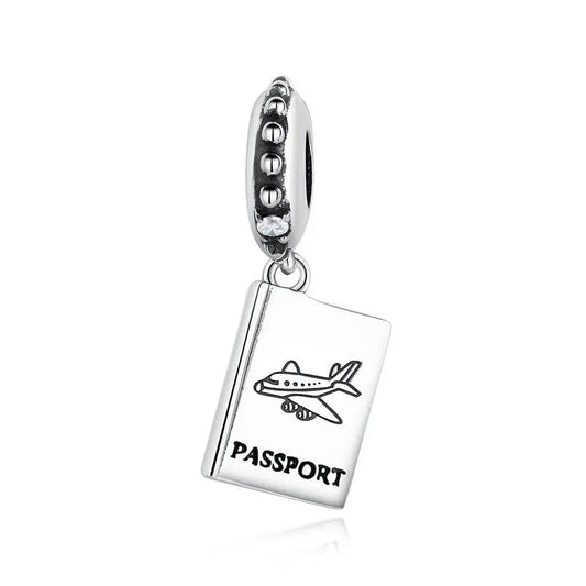 Sterling silver passport charm with airplane engraving and beaded bail with cubic zirconia.