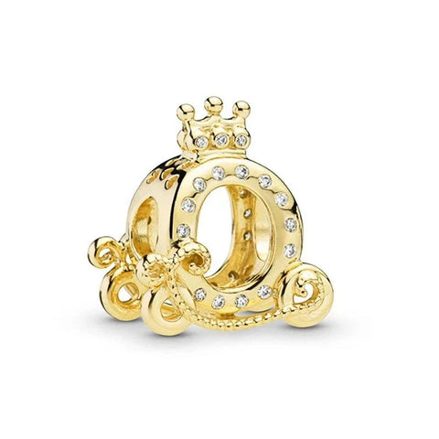 Gold charm with a crown and decorative elements on a white background