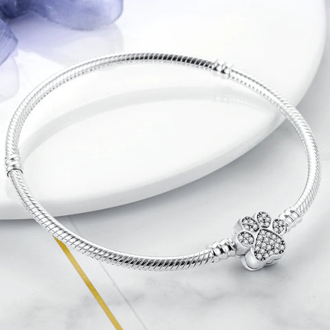 Elegant silver bracelet with a crystal-studded paw print clasp, a perfect gift for dog and cat owners.