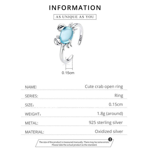 Product information card showing a cute crab-shaped sterling silver ring with a blue transparent glass stone.