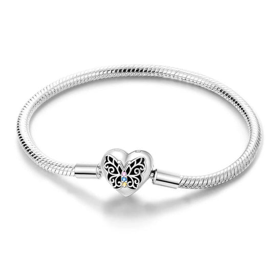 Sterling silver bracelet with a butterfly heart charm, compatible with Pandora charms.