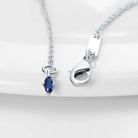 Elegant Blue Sapphire Oval Pendant Necklace in Sterling Silver with Cubic Zirconia Accents - Close-up of the clasp and additional blue sapphire detail on the sterling silver necklace.