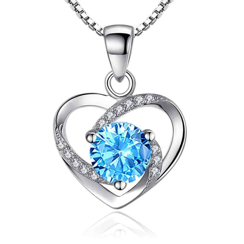 Heart Pendant Necklace with Blue Crystal and Sparkling Accents - Sterling silver heart pendant necklace with blue crystal.