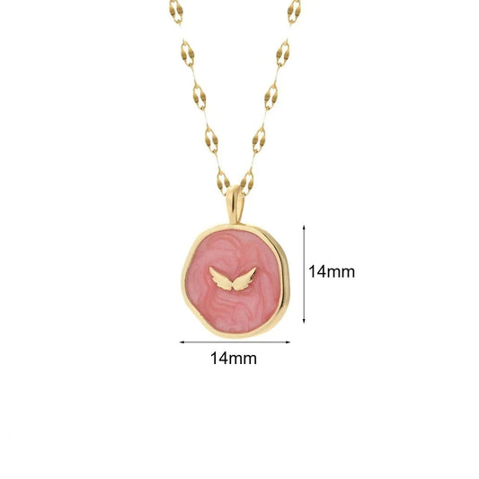 Gold-plated butterfly pendant necklace with pink enamel inlay, pendant measures mm in diameter.