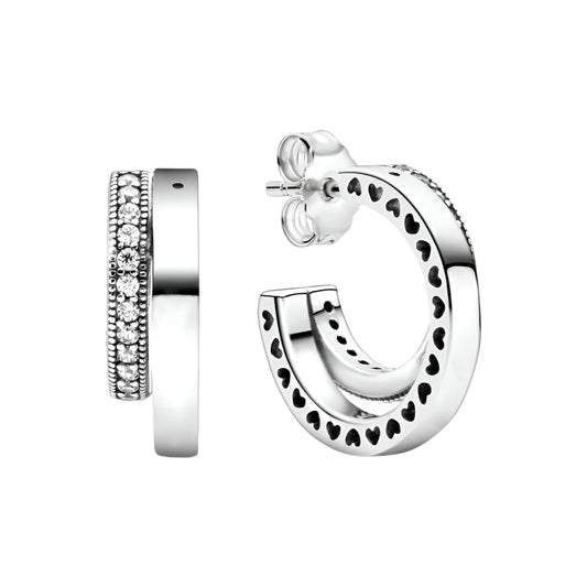 Sterling silver open hoop earbands with heart cutout design and sparkling crystals.