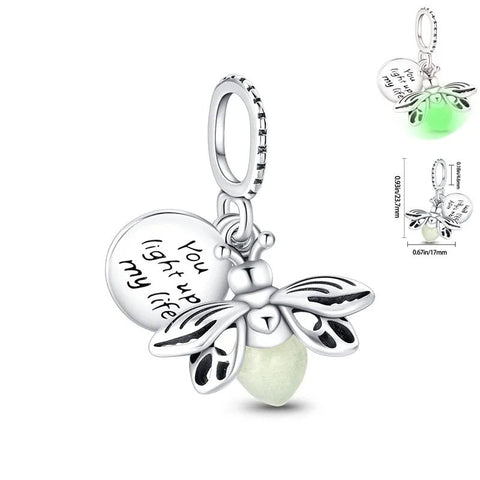Firefly charm with luminous green enamel body and "You Light Up My Life" inscription.