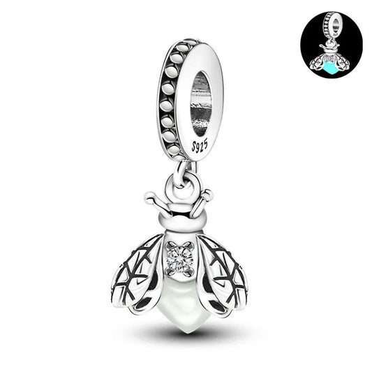 Sterling silver firefly charm with luminous enamel body and cubic zirconia.