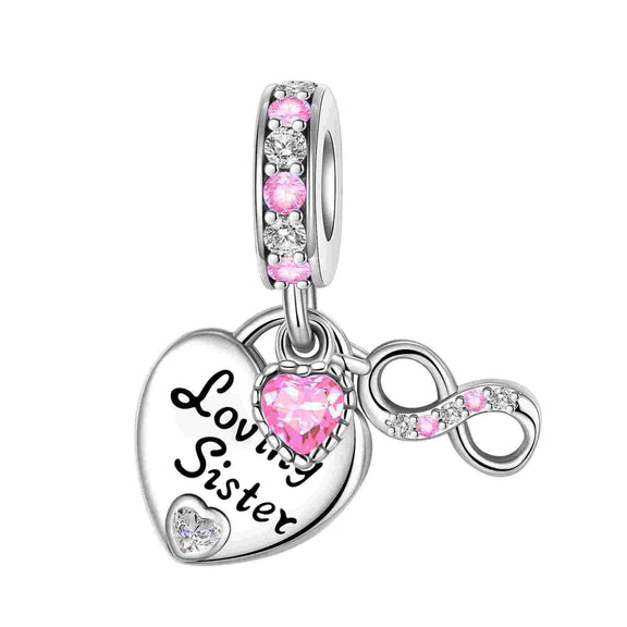 Loving Sister Charm - Sterling silver charm featuring "Loving Sister" inscription and pink and white crystals.