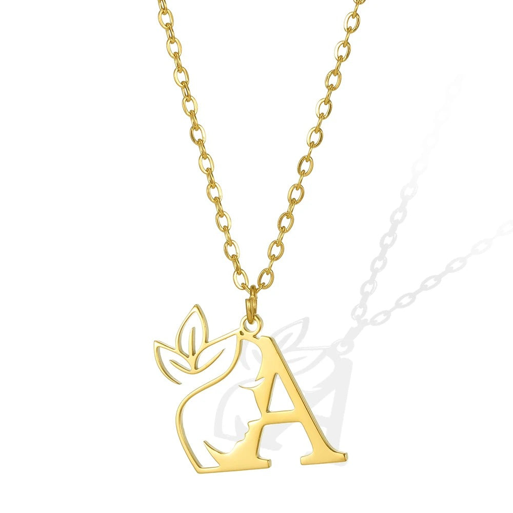 A: Elegant gold necklace with an 'A' pendant and intricate leaflet design.