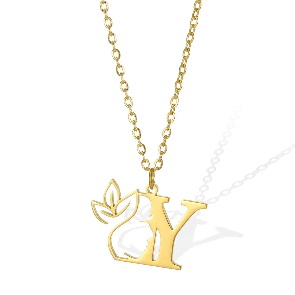 Y: Youthful gold necklace featuring a 'Y' pendant and a detailed leaflet design.