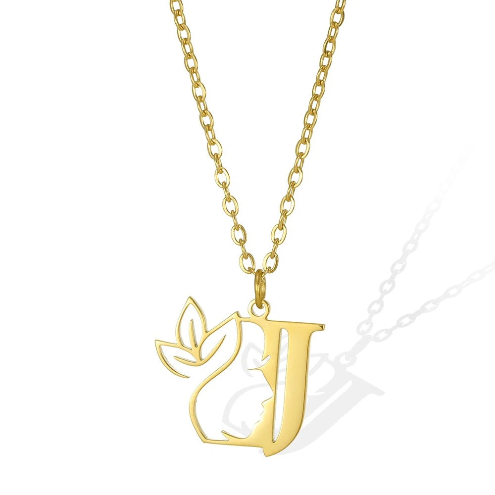 J: Jewel-like gold necklace featuring a 'J' pendant and an exquisite leaflet.