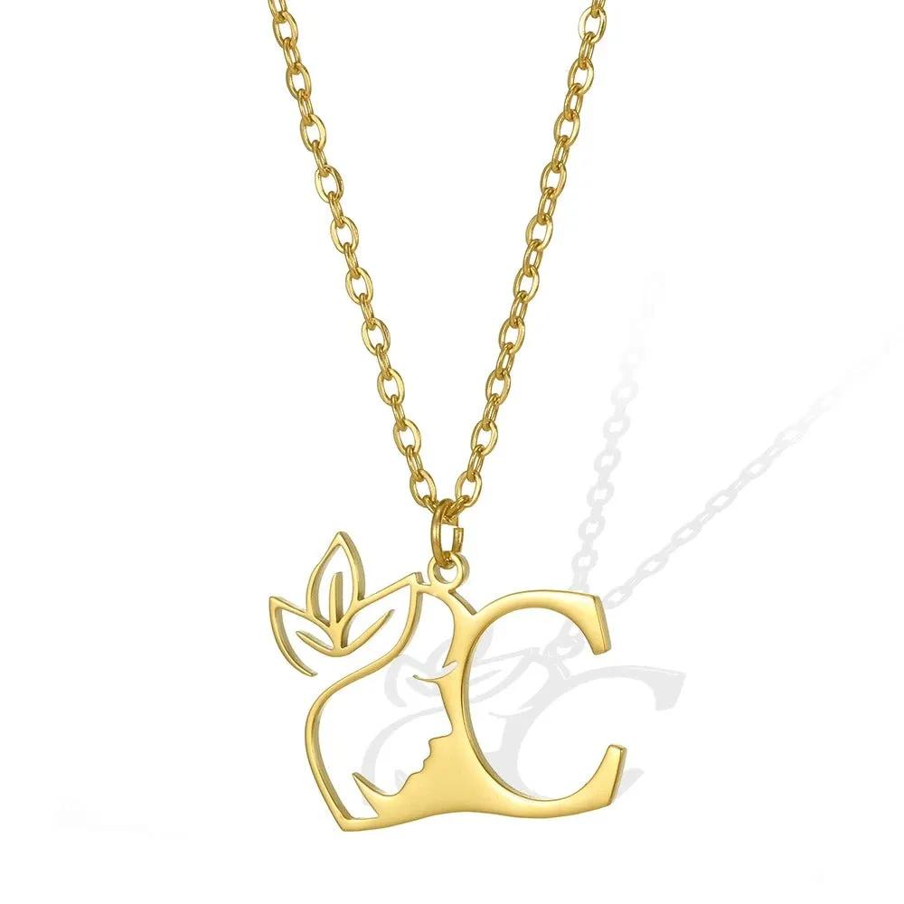 C: Chic gold necklace with a 'C' pendant and a finely crafted leaflet.