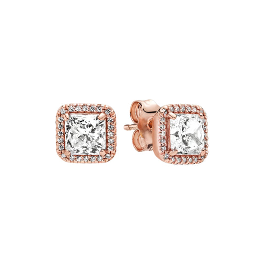 Timeless white diamond stud earrings with a rose gold setting and diamond halo.